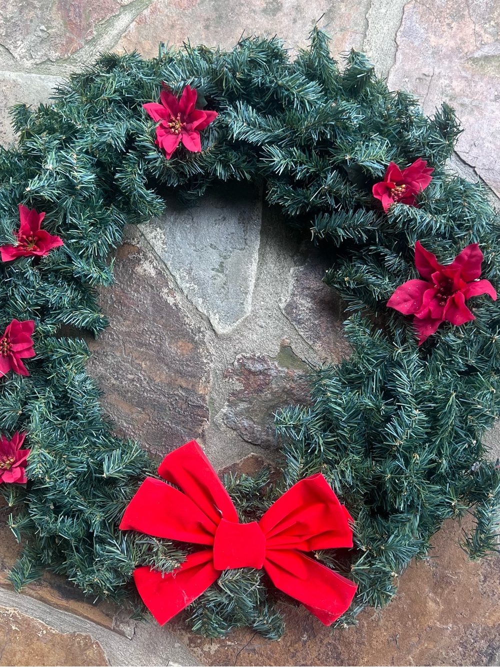 Festive Green Holiday Wreath with Red Bow and Poinsettias
